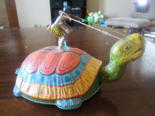 Vintage tin wind up toy Turtle with Indian