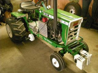 Garden tractor like a cub cadet pulling tractor made to look like a 