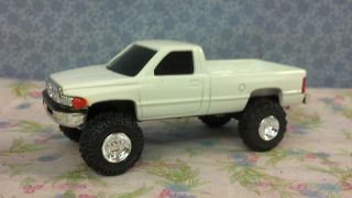 Ertl 1/64th DODGE, Lifted Up, Custom Rubber Tires, Very Nice Looking 