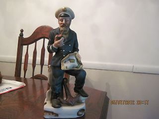   listed VINTAGE PORCELAIN SHIP CAPTAIN SMOKING A PIPE HOLDING A MAP