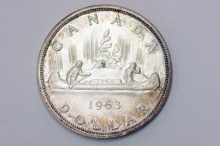Lovely Rainbow Toned 1963 Canadian Silver Dollar MS