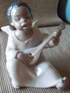 LLADRO YOUNG BLACK ANGEL PLAYING INSTRUMENT