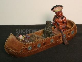 Native American Indian and Wolf in Canoe Figurine