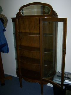 Antique Oak bow front china cabinet / curio With mirror