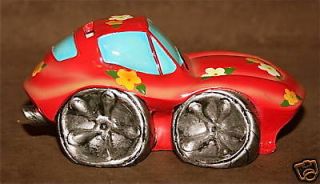 red flower covered car piggy bank with rubber stopper time