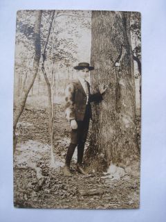 VINTAGE RPPC YOUNG BOY DRESSED IN KNICKERS W/ HAT IN BLACK SWAMP EARLY 