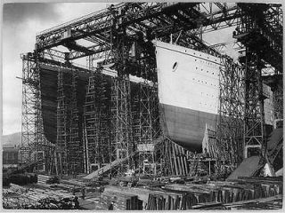 OLYMPIC,TITANIC   view of bows in shipyard construction scaffolding 