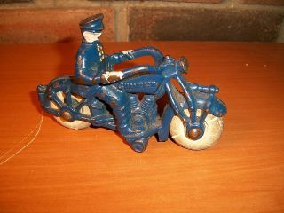 pre war champion cast iron motorcycle cop toy time left
