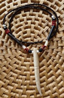   this casual yet elegant necklace this beaded tusk necklace is made