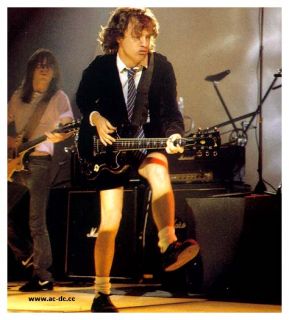   famous sg guitar players to ever walk the planet mr angus young of