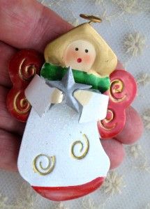 THIS IS A CUTE METAL ANGEL PIN WITH WHITE GLITTER ENAMEL FOR THE GOWN 