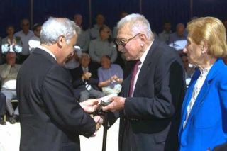 President Moshe Katsav presenting the ribbon to former president Ezer 