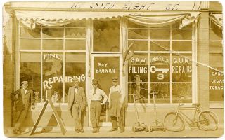 Atchison KS Kansas Repair Shop Shoes Guns 1912 RPPC Postcard