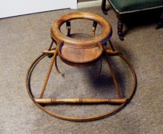 old 1800s brown wooden baby seat walker