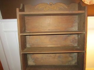 Old primitive wall shelf with towel bar nice wheat design on top