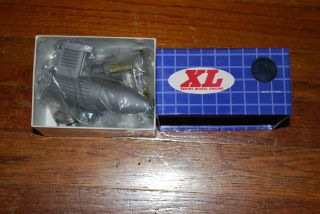 older Magnum XL 53 two stroke engine complete w muffler new in box