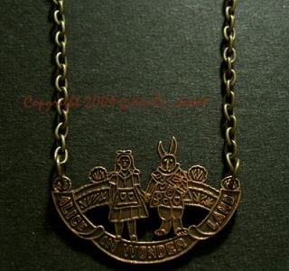 vintage alice in wonderland antiqued brass charm necklace