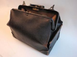 you are bidding on a large black leather antique doctors bag the locks