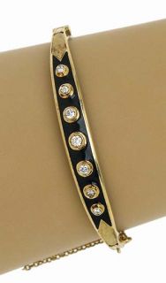  is a vintage 14k gold diamonds and enamel bangle bracelet the piece