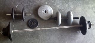  of iron weight plates barbell bar and 2 dumbbell bars plus free bonus