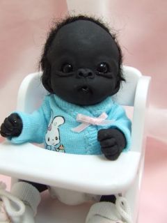  week is tiny little zoe. She is a precious little baby gorilla