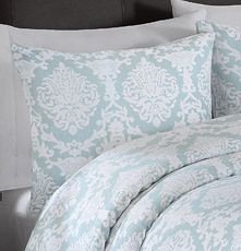 Dress up your guest room with pillow shams you would find at a high