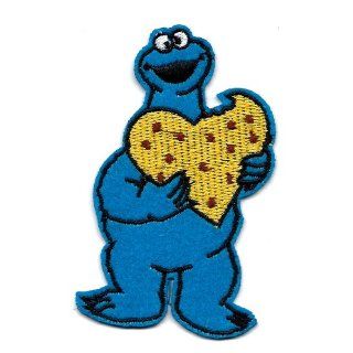 Cookie Monster eating heart shaped chocolate chip cookie