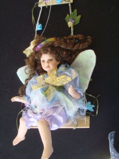 DOLL Cathay Collection Porcelain Whimsical Girl on Swing Long Brown