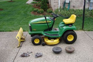 LT166 RIDING LAWN MOWER W/PLOW, REAR WHEELS WEIGHTS, AND TIRE CHAINS