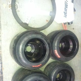 of Used Racing Go Kart Tires An Rims with Steering An Fuel Tank