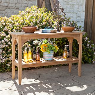 Upton Home Brookford Teak Outdoor Console Table (BrownTeak offers elegance, durability, and resistance to the elementsIncludes two (2) open shelvesShelf 42.75 inches wide x 16.75 inches high x 13.5 inches deepUnder table 9.75 inches highMax weight capac