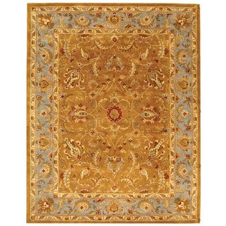 Handmade Heritage Shahi Brown/ Blue Wool Rug (83 X 11) (BrownPattern OrientalMeasures 0.625 inch thickTip We recommend the use of a non skid pad to keep the rug in place on smooth surfaces.All rug sizes are approximate. Due to the difference of monitor 