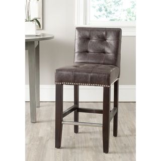 Safavieh Thompson Antique Brown Counter Stool (Antique brownIncludes One (1) stoolMaterials Iron, birch wood and PUFinish EspressoSeat dimensions 16.7 inches width and 14.8 inches depthSeat height 23.4 inchesDimensions 34.4 inches high x 16.7 inches